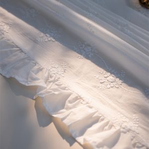 Elegant embroidered tablecloth set for an outdoor garden brunch