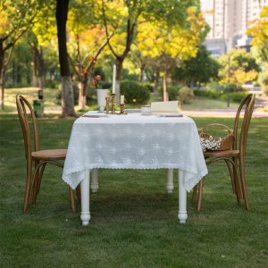 Romantic vintage tablecloth with ruffled lace edge, perfect for dining rooms