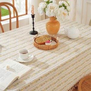 detailed view of delicate yellow flower print on cotton fabric