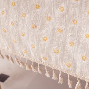Bohemian tassel edge tablecloth on rectangular dining table – warm natural sunlight