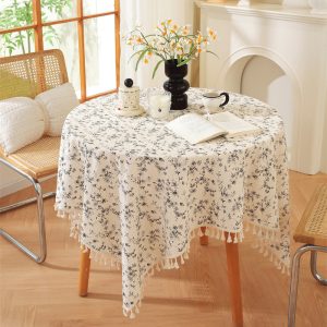 Full view of vintage-inspired cotton tablecloth with soft fringe