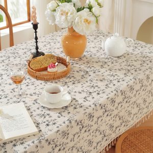 Soft 100% cotton floral tablecloth in neutral tones with natural tassels