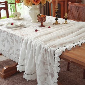 Rustic garden brunch setup with embroidered cotton tablecloth