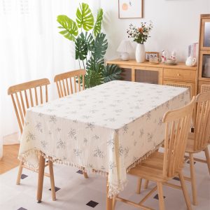 Tassel edge detail of handcrafted cotton tablecloth with vintage look