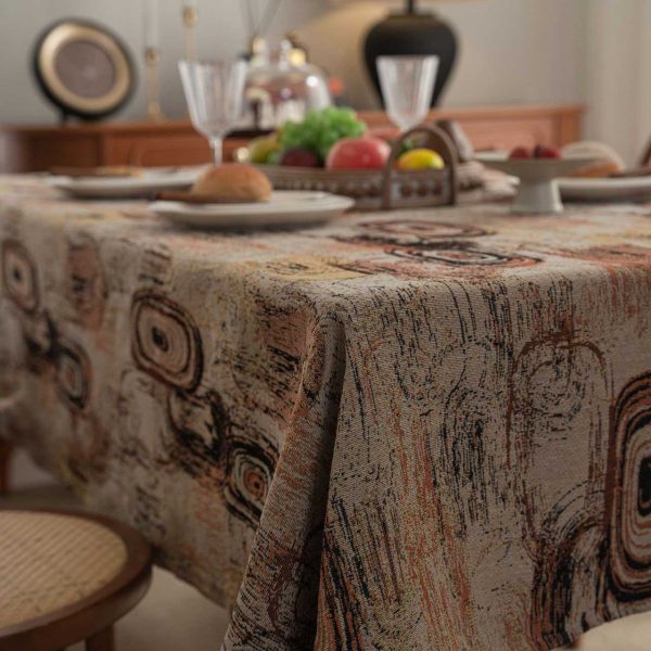 Retro-style cotton linen tablecloth with abstract jacquard design in coffee brown tones, ideal for artistic or mid-century modern dining spaces.