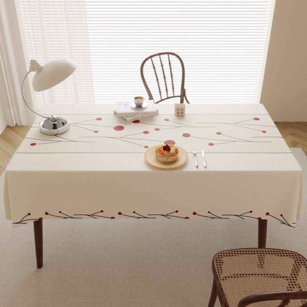 Elegant faux leather waterproof tablecloth with red dotted design, perfect for modern dining spaces and outdoor meals.