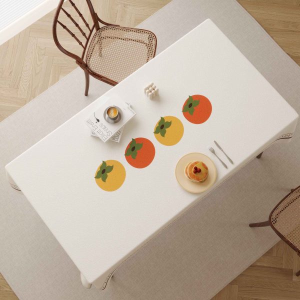 Faux leather tablecloth with persimmon pattern and “HAPPY LIFE” message, designed for easy maintenance and a stylish dining experience.