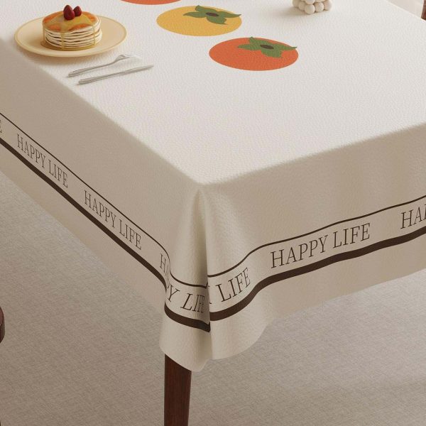 Faux leather tablecloth with persimmon pattern and “HAPPY LIFE” message, designed for easy maintenance and a stylish dining experience.