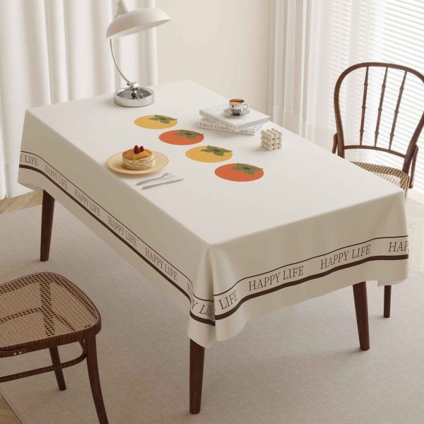 Faux leather tablecloth with persimmon pattern and “HAPPY LIFE” message, designed for easy maintenance and a stylish dining experience.