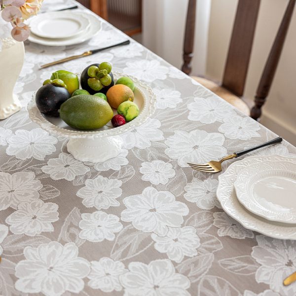 Soft polyester lace tablecloth with camellia motif, ideal for elegant dining and home decor.