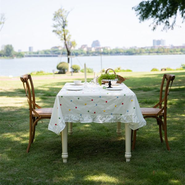 Cotton embroidered tablecloth with colorful floral embroidery and lace edging, ideal for home dining, special occasions, and outdoor gatherings. Soft cotton material with elegant design.
