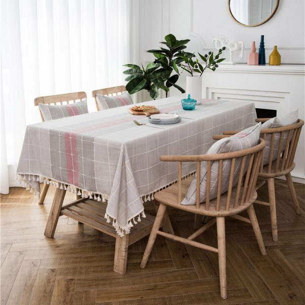 Gray faux linen tablecloth with colorful stripes and tassel fringe edges, ideal for modern dining rooms, outdoor use, or casual restaurant settings.