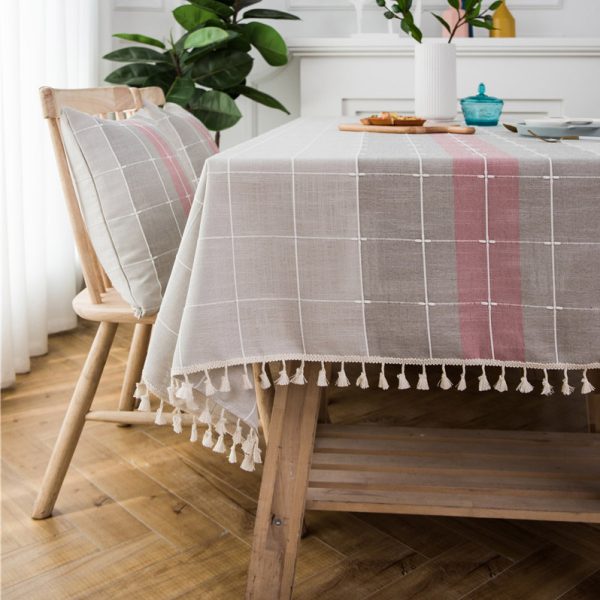 Gray faux linen tablecloth with colorful stripes and tassel fringe edges, ideal for modern dining rooms, outdoor use, or casual restaurant settings.