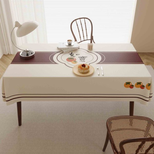 Fruit-print waterproof outdoor tablecloth in beige faux leather, styled for patio or farmhouse kitchen decor.