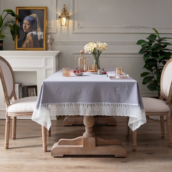 Elegant purple-gray cotton tablecloth with scalloped meteor edges, draped over a modern dining table with natural lighting and minimalist decor.
