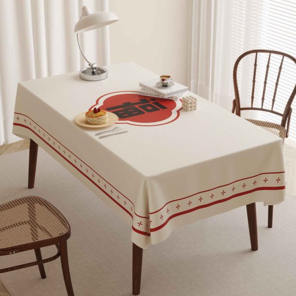 Faux leather tablecloth with red "Fu" character design, perfect for bringing good fortune and style to your dining table.