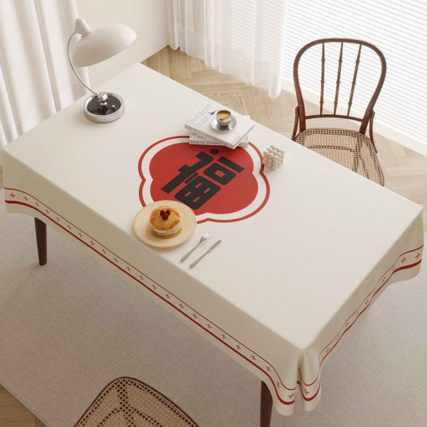 Faux leather tablecloth with red "Fu" character design, perfect for bringing good fortune and style to your dining table.