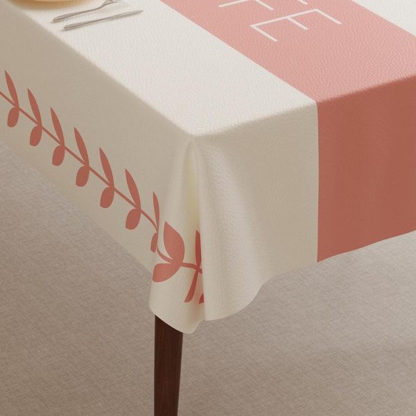 Folded faux leather tablecloth showing durable material and elegant pink print