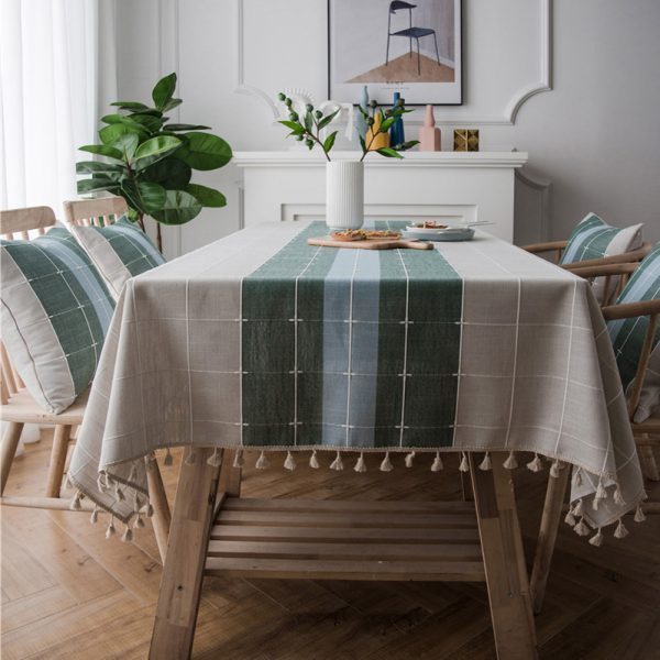 Gray faux linen tablecloth with colorful stripes and tassel fringe edges, ideal for modern dining rooms, outdoor use, or casual restaurant settings.