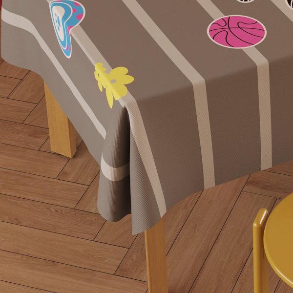 Outdoor patio scene with waterproof outdoor tablecloth showcasing cheerful dog print and easy-clean surface