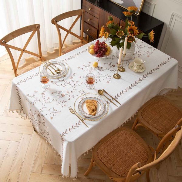 Elegant camp tablecloth with floral embroidery set for an outdoor brunch
