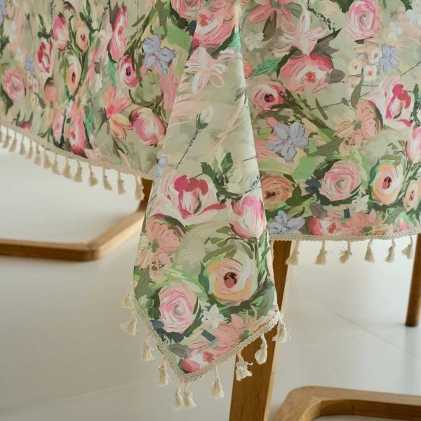 Lightweight pink polyester tablecloth with a delicate garden-inspired design