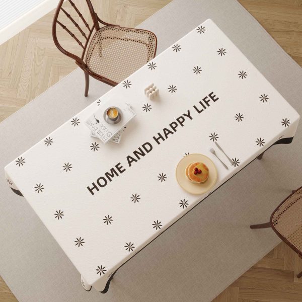 Beige faux leather tablecloth with black border and star pattern, ideal for home, outdoor, and restaurant use.