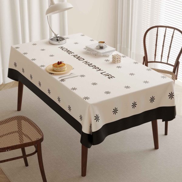 Beige faux leather tablecloth with black border and star pattern, ideal for home, outdoor, and restaurant use.