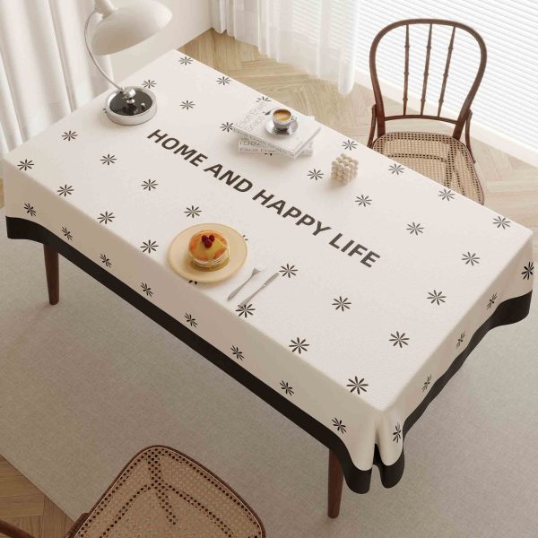 Beige faux leather tablecloth with black border and star pattern, ideal for home, outdoor, and restaurant use.