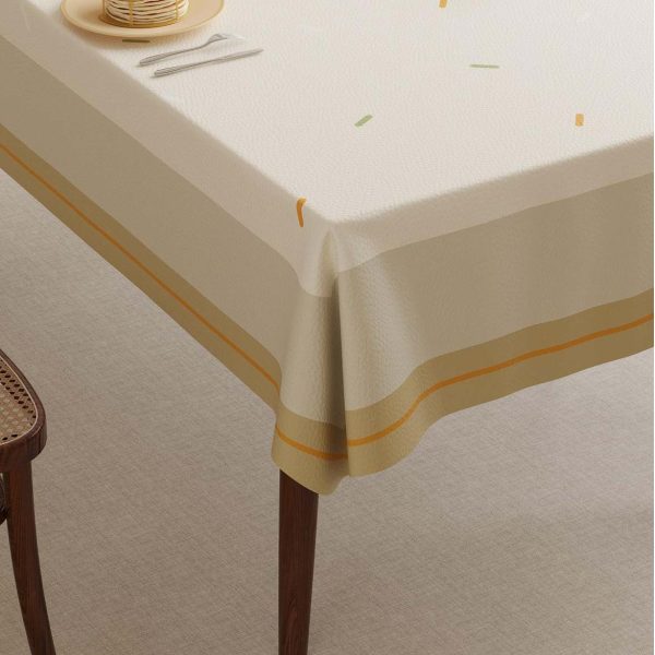 Stylish faux leather waterproof tablecloth with striped and dotted design, perfect for modern dining rooms and outdoor meals.