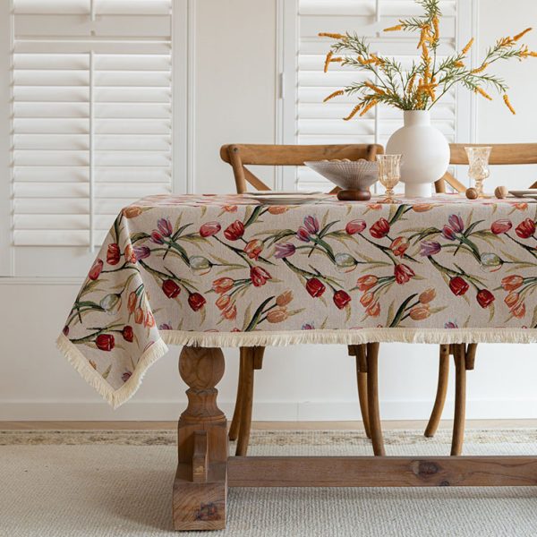 Folded floral cotton tablecloth showcasing its fine weave and elegant botanical print