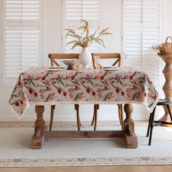 Breathable cotton linen tablecloth with tulips used outdoors on a patio table