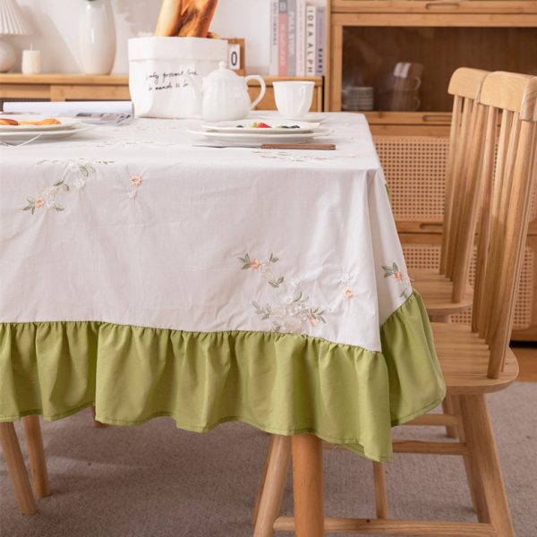 White cotton embroidered tablecloth with lemon and leaf design, featuring green ruffled edges, ideal for summer dining, outdoor picnics, or farmhouse-style kitchens.