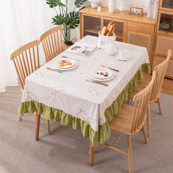 White cotton embroidered tablecloth with lemon and leaf design, featuring green ruffled edges, ideal for summer dining, outdoor picnics, or farmhouse-style kitchens.