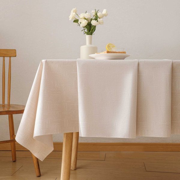 Beige geometric waterproof tablecloth made from PVC, oil-resistant and wipeable for indoor and outdoor dining settings.