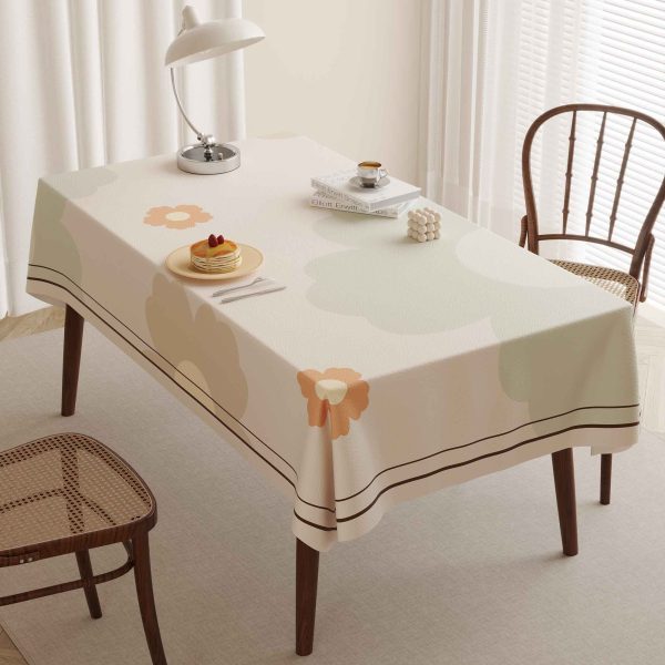 Faux leather tablecloth with floral pattern and waterproof features, perfect for modern homes and outdoor settings.