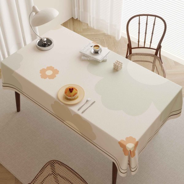 Faux leather tablecloth with floral pattern and waterproof features, perfect for modern homes and outdoor settings.