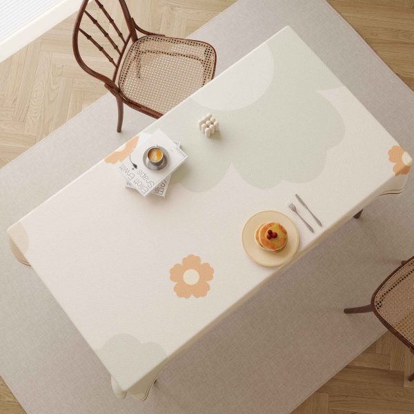 Faux leather tablecloth with floral pattern and waterproof features, perfect for modern homes and outdoor settings.