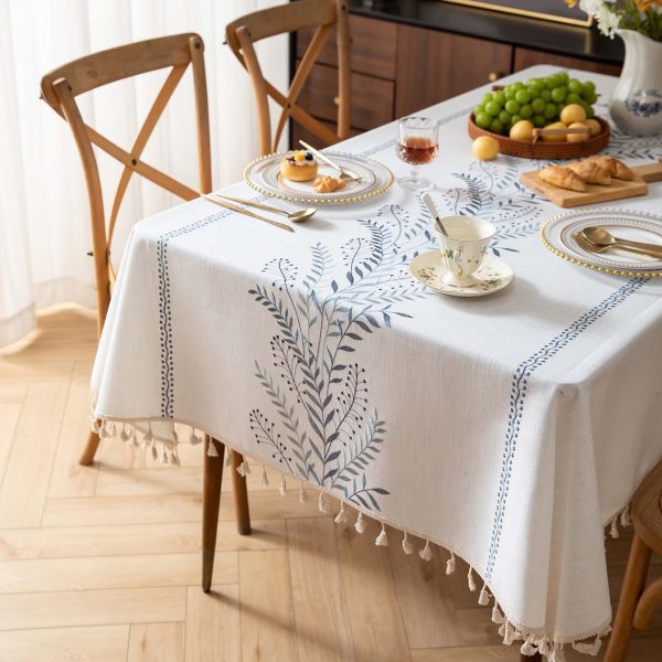 Overhead shot of a picnic setup featuring washable beige table cover with botanical patterns
