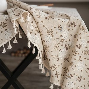 Neutral-toned vintage table linens styled on a wooden table