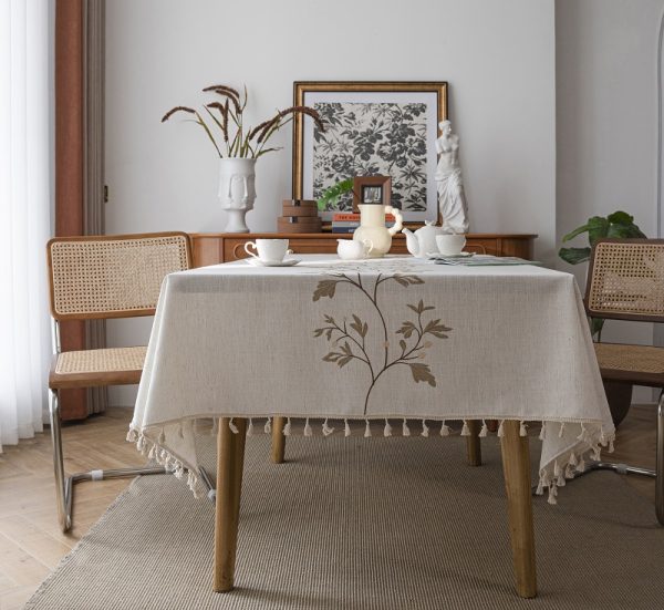 Tassel edge detail on washable faux linen table cover for kitchen or outdoor use