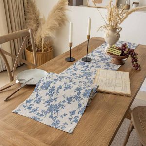 Elegant blue table runner with classic floral patterns on dining table