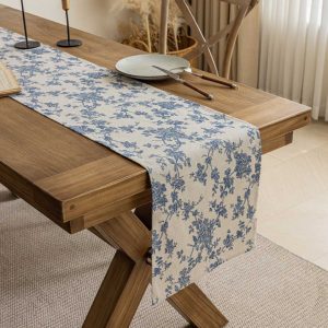 Artistic blue and white table runner with botanical print for home décor