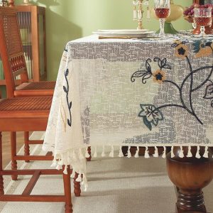 Elegant vintage table linens in neutral tones styled for a cozy dinner