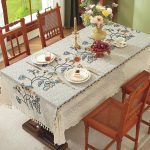 Romantic European-style table setting with floral embroidered tablecloth