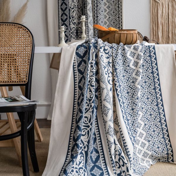 Dining room with antique vintage tablecloth and blue ceramic dishes