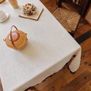 Elegant vintage table linens in rustic dining setting