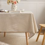Soft beige cotton linen tablecloth used outdoors on picnic table