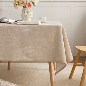 Soft beige cotton linen tablecloth used outdoors on picnic table