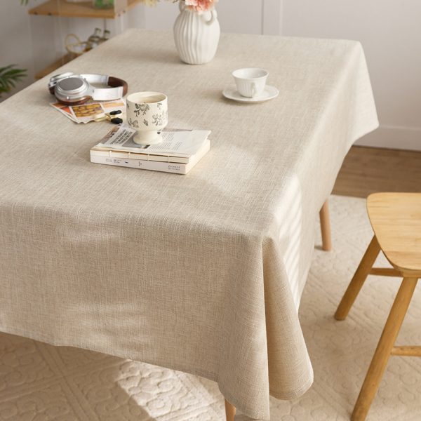 Beige vintage table linens on a wooden dining table with rustic decor